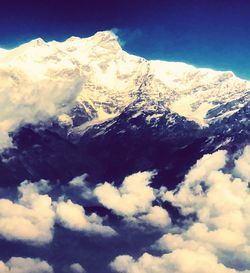 Scenic view of snow covered mountains against sky