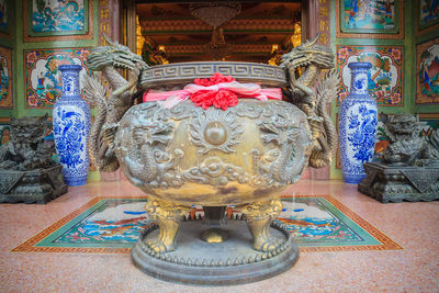 Close-up of buddha statue in temple building