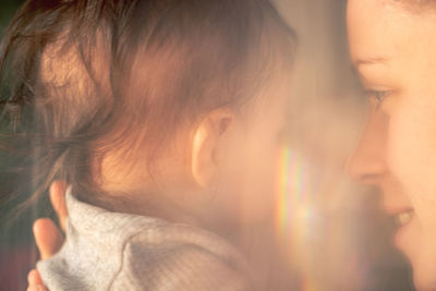 Mother and baby portrait with refraction of light