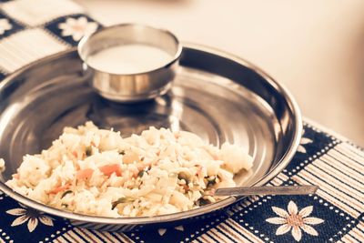 Fried rice with some veggies and yogurt