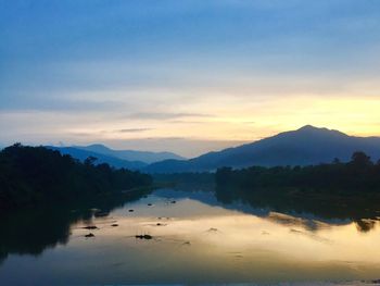 Scenic view of lake against sky during sunset