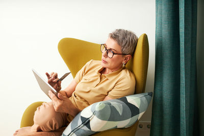 Senior woman doing online shopping at home