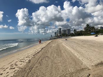 Panoramic view of beach against sky in city