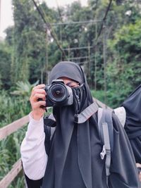 Portrait of man photographing