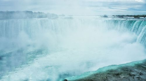 Scenic view of frozen waterfall