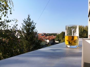 View of beer glass against sky
