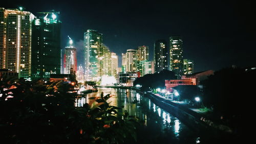 Aerial view of city lit up at night