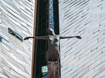 Low angle view of statue against building