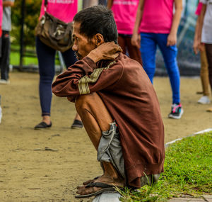 Rear view of people on street