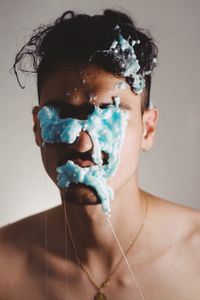 Close-up of young man with facial mask on face