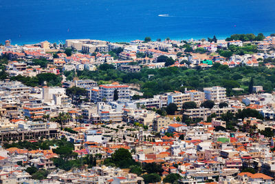 High angle view of townscape by sea