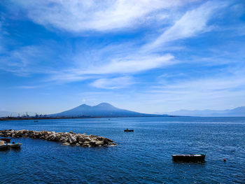 Scenic view of sea against blue sky