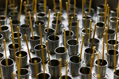 Full frame shot of sticks in containers