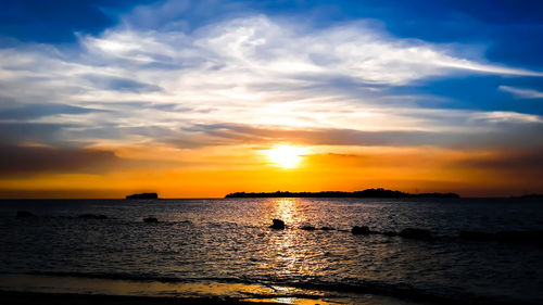 Scenic view of sea against sky during sunset