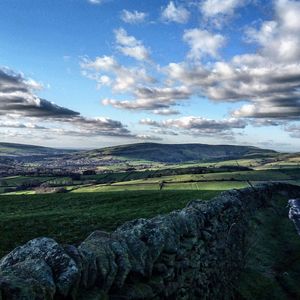 Scenic view of landscape against cloudy sky