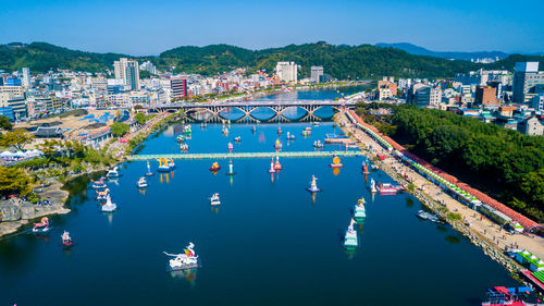 High angle view of boats in city