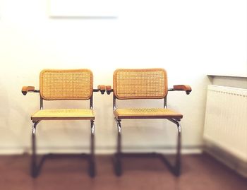 Close-up of empty chairs on table