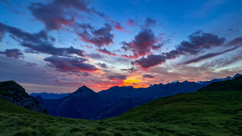 Scenic view of mountains against sky during sunset