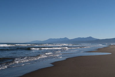 Scenic view of sea against clear sky