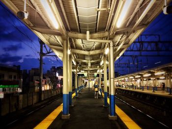 Train at railroad station at night