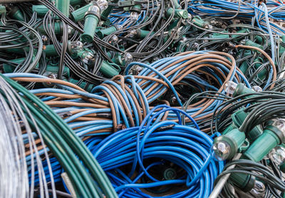 Close-up of cables against blue sky