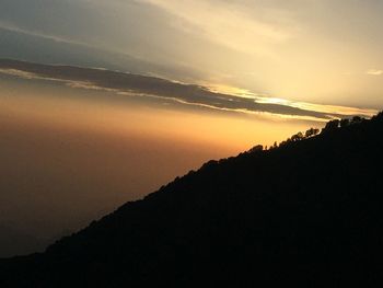 Scenic view of mountains at sunset