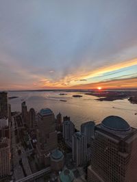 High angle view of buildings against sky during sunset