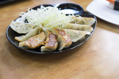 Close-up of bread in plate on table