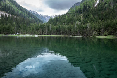 Scenic view of lake and mountains against sky