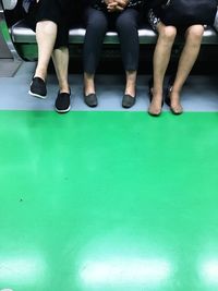Low section of men sitting