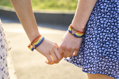 Midsection of woman holding hands