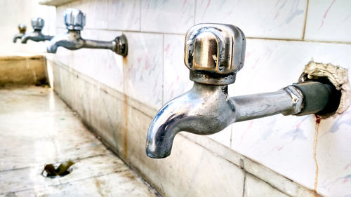 Close-up of faucet on wall