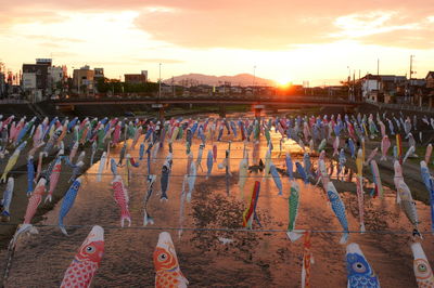 Panoramic view of people at sunset