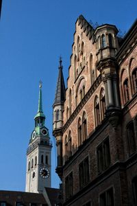 Low angle view of historic building against blue sky