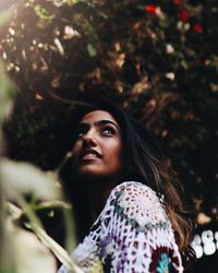 Portrait of young woman looking away