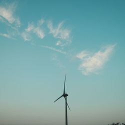 Low angle view of windmill against sky