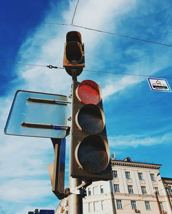 Low angle view of road sign against building