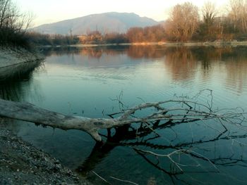 Scenic view of lake with mountains in background