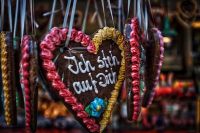 Close-up of heart shape hanging on display at market stall