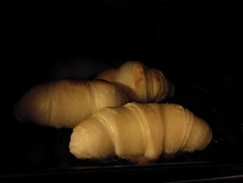 Close-up of bread against black background