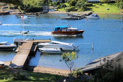 High angle view of boats moored at harbor