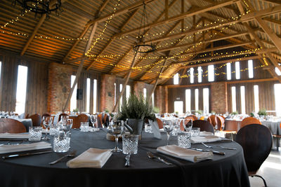 Empty chairs and tables in restaurant