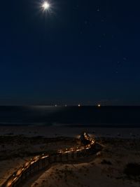 Scenic view of sea against sky at night