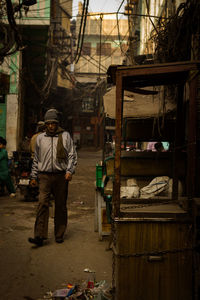 Rear view of man standing in market