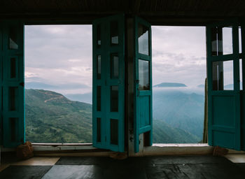 Scenic view of mountains seen through windows