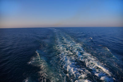 Scenic view of sea against clear blue sky