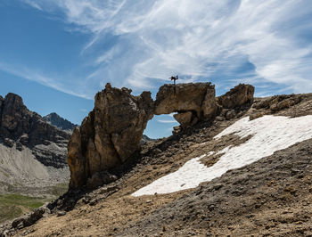 Low angle view of rock formations against sky