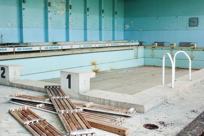 Abandoned swimming pool against wall