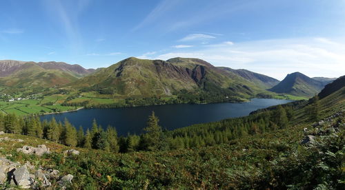 High angle shot of calm lake along countryside landscape