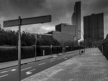 View of basketball hoop in city against sky